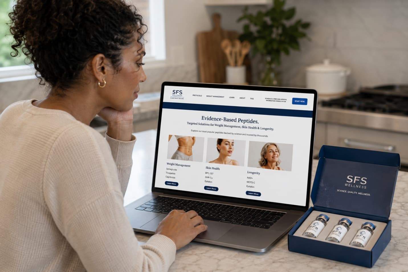 Person viewing the SFS Wellness website on a laptop beside a product box